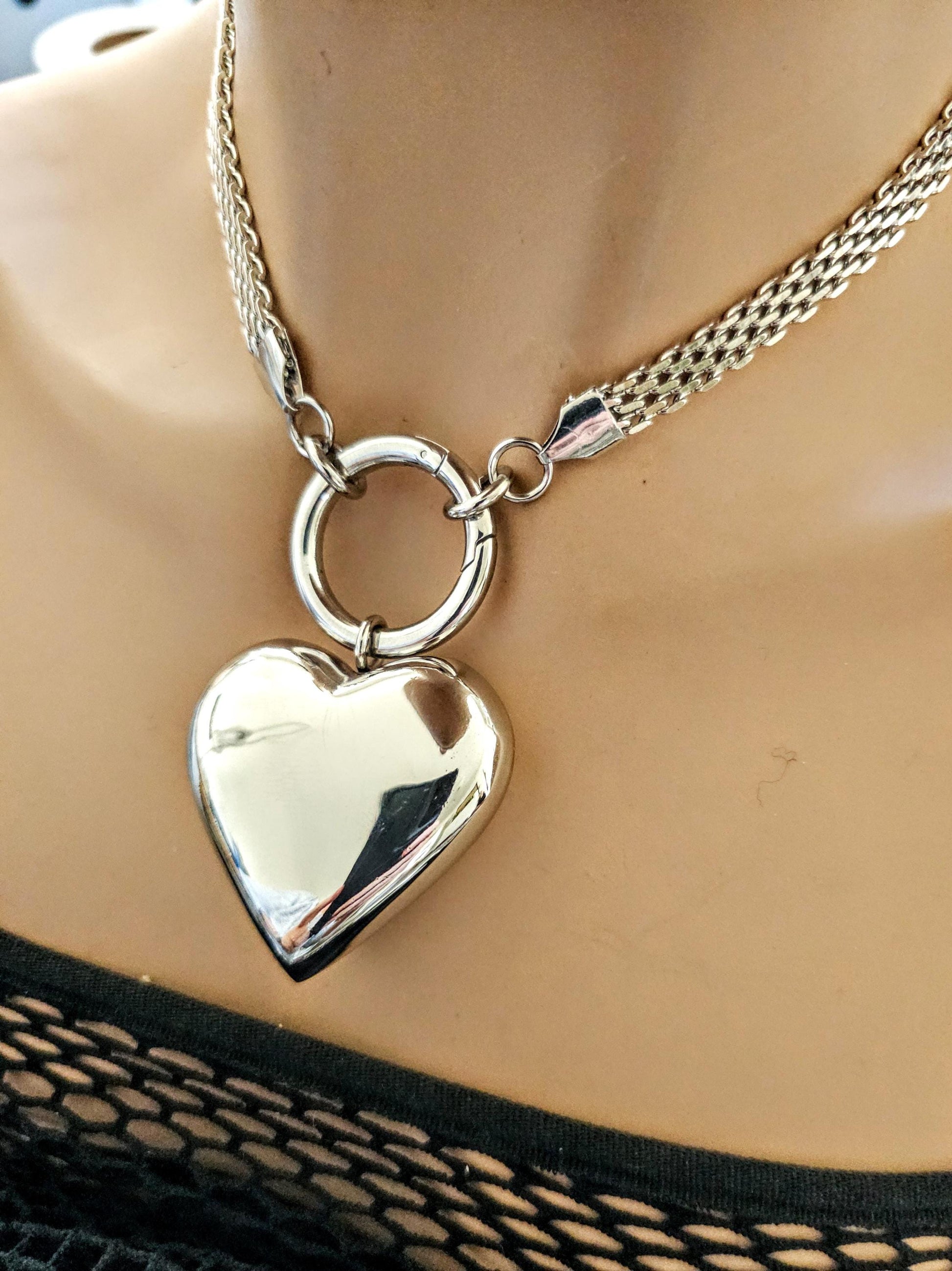 A stainless steel 3D hollow bubble heart choker pendant Necklace. Hypoallergenic, waterproof and non tarnish.