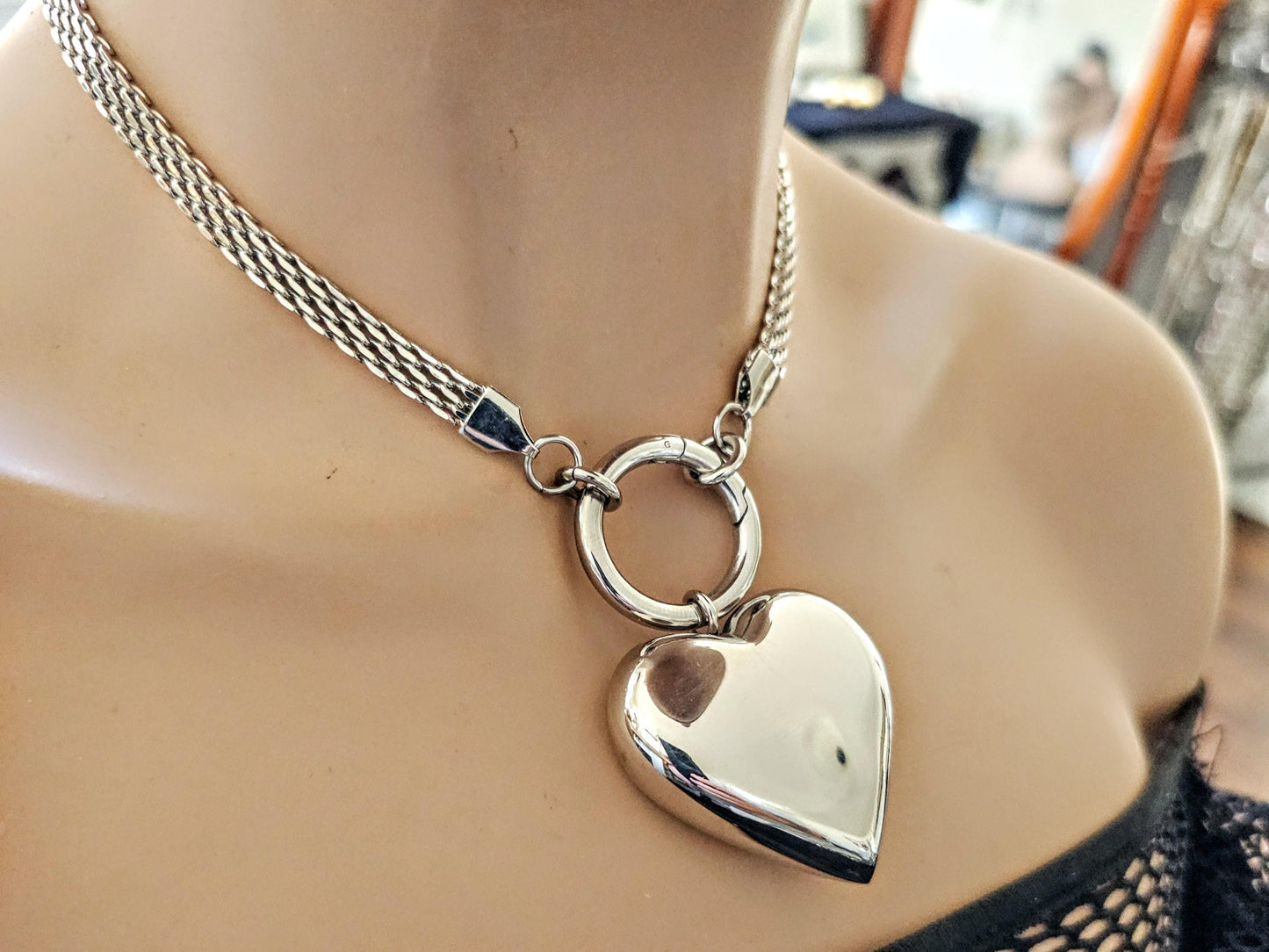 A stainless steel 3D hollow bubble heart choker pendant Necklace. Hypoallergenic, waterproof and non tarnish.